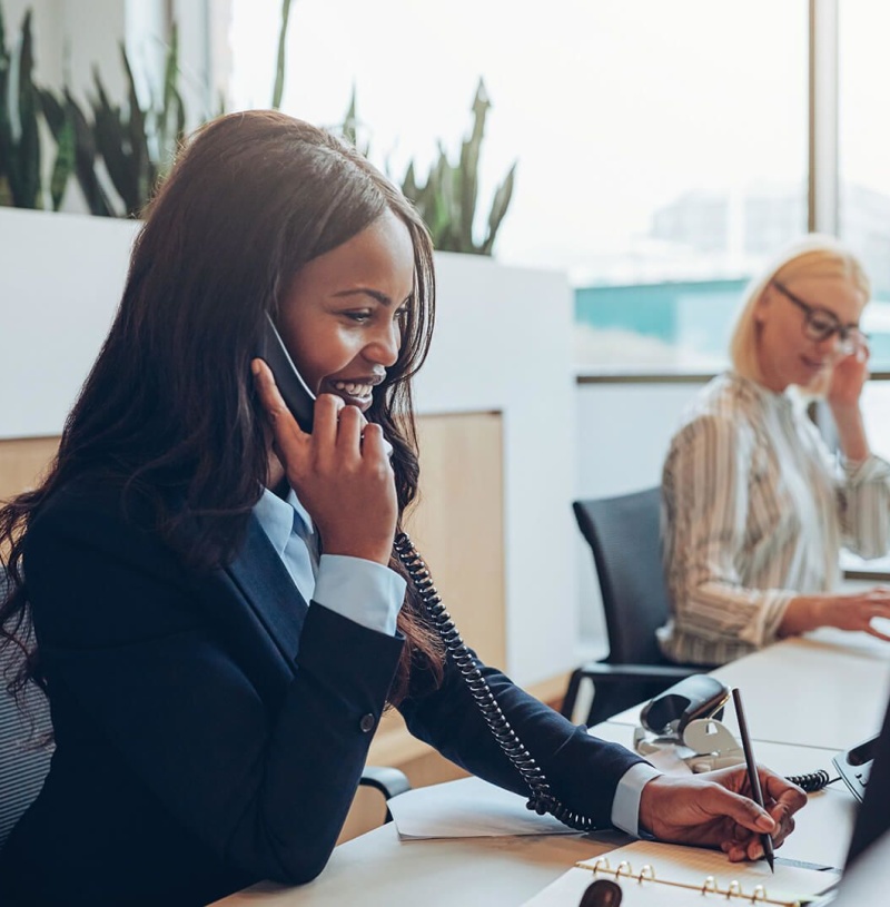 Young-African-American-businesswoman-smiling-and-talking-on-phone